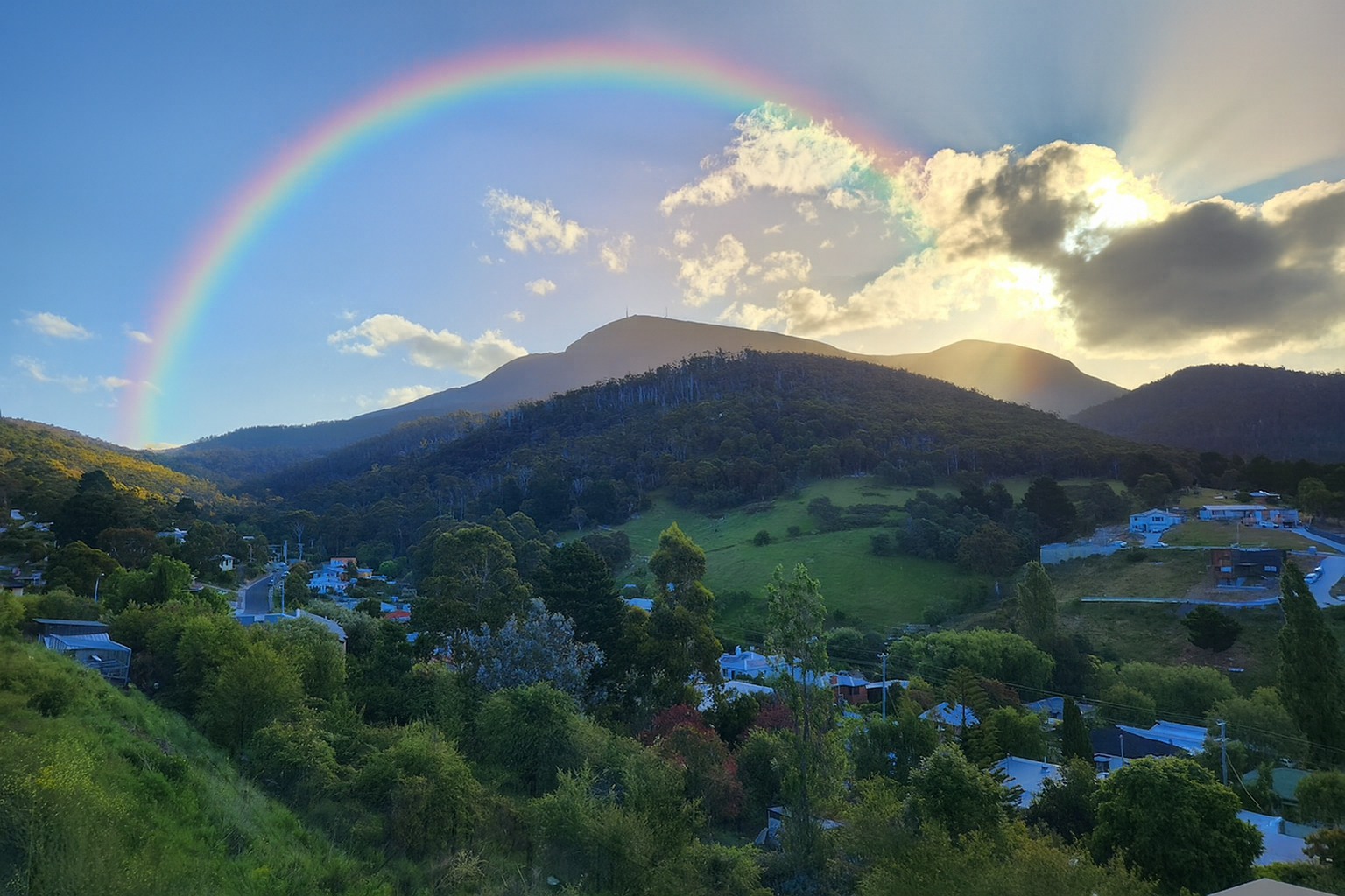 Lenah Valley, Tasmania - A beautiful valley with mountains and a rainbow